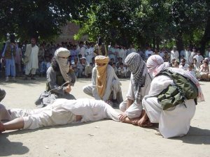 Pakistani Taliban punishes a butcher with a whip