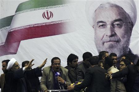 Iranian presidential candidate Rohani waves to supporters in the central Iranian city of Shiraz