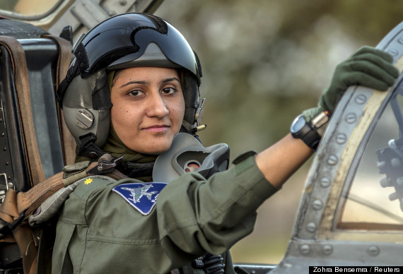 Ayesha Farooq, 26, Pakistan's only female war-ready fighter pilot, poses for photograph as she sits in the cockpit of a Chinese-made F-7PG fighter jet at Mushaf base in Sargodha