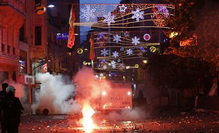 Riot police use tear gas to disperse the crowd during an anti-government protests at Taksim Square in central Istanbul