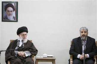 File picture shows Iran's Supreme Leader Ayatollah Khamenei looking on as Hamas leader Meshaal speaks during official meeting in Tehran