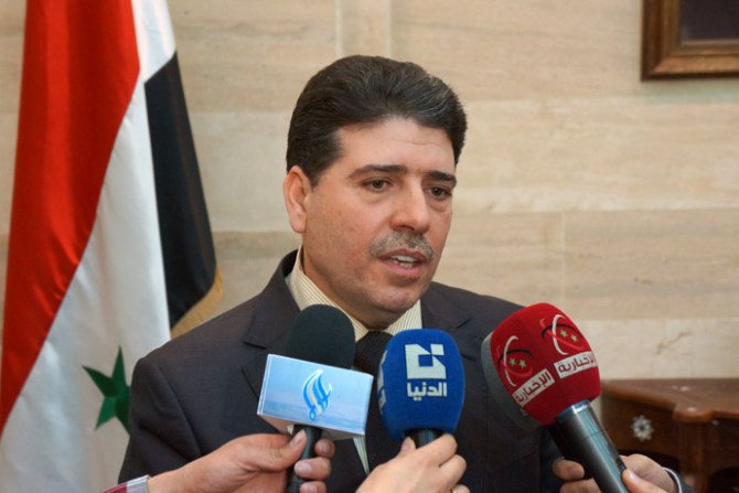 Syrian Prime Minister Wael al- Halqi