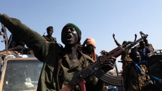 SPLA soldiers sing as they celebrate in Bentiu, Unity state