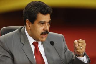 Maduro speaks during a news conference at Miraflores palace in Caracas