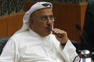Kuwaiti MP Nabil al-Fadel smokes a cigar