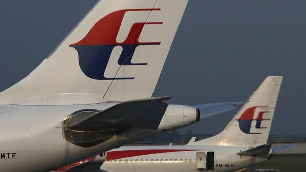 Malaysia Airlines planes sit on the tarmac at Kuala Lumpur International Airport