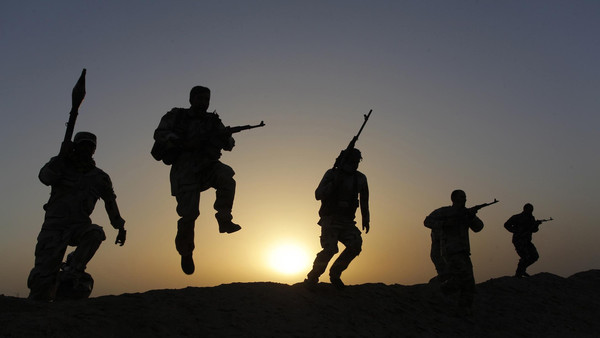 Shi'ite volunteers patrol the area as they secure it against the predominantly Sunni militants from the Islamic State in the desert region between Kerbala and Najaf