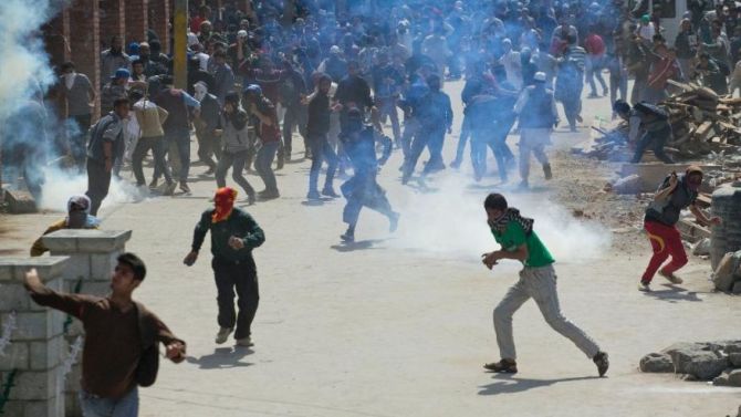 Youth Protesting against security forces in Indian Occupied Kashmir d