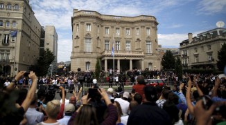 People attend the opening of the new Cuban embassy in Washington