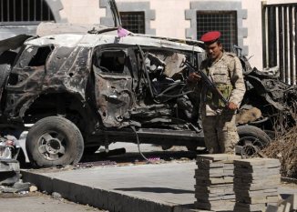 Survivors visit the site of bombing at Yemen's Defense Ministry